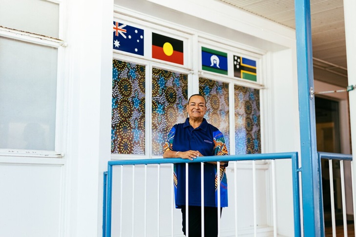 A proud indigenous liaison officer stands on the verandah at Bowen Hospital