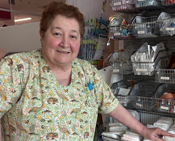 A special care nurse stands in front of equipment