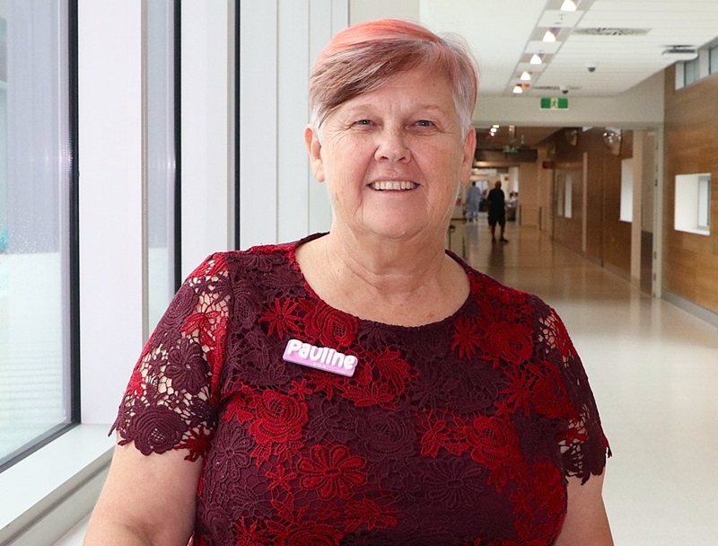 Retiring director of nursing at Sarina Hospital stands in the hospital hallway