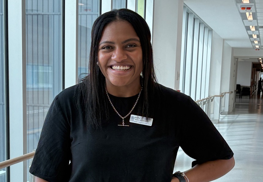 A social worker stands in a hospital hallway