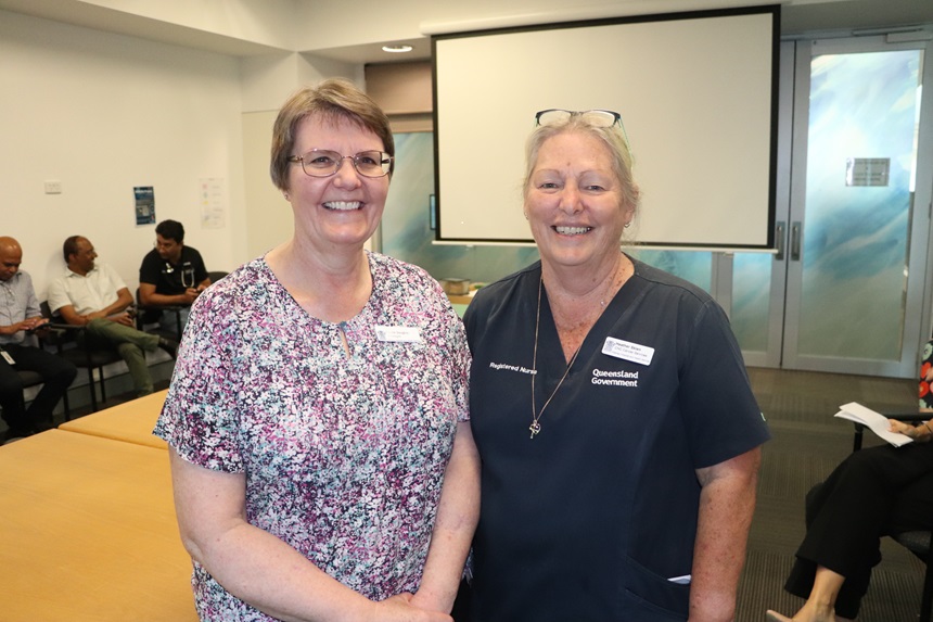 A retiring oncology doctors with a long-serving nurse