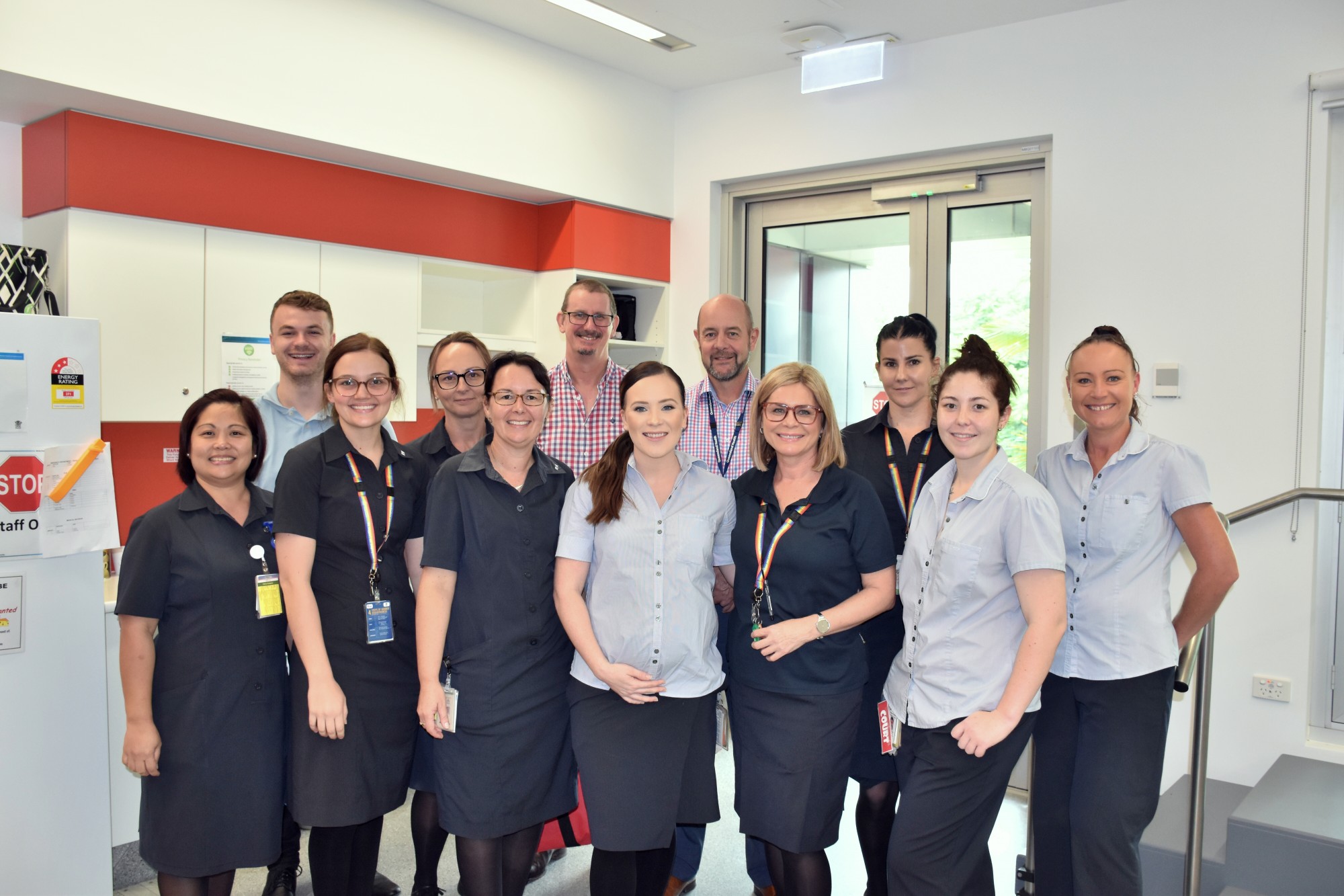 Director of Orthopaedics Dr Jonathan Smith and Acting Chief Executive Marc Warner (back row) with some of the ward's staff.